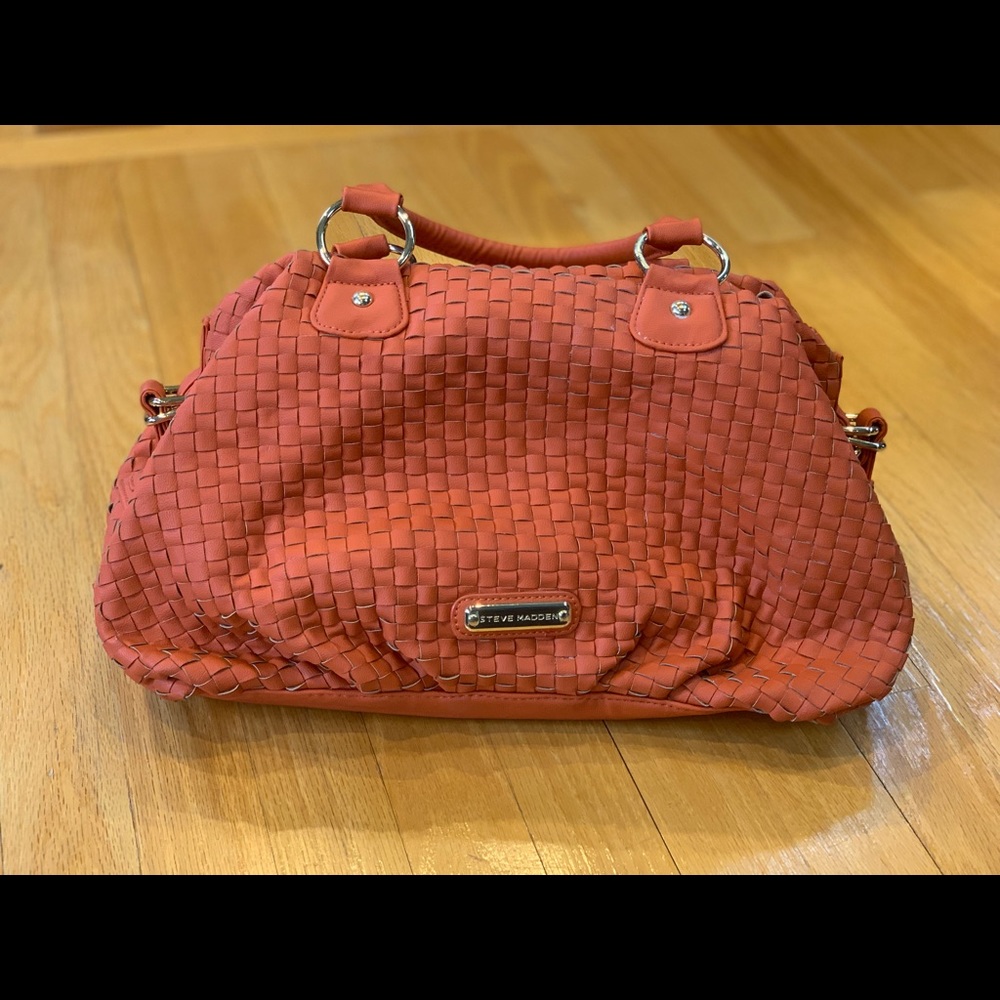 Orange Steve Madden handbag.